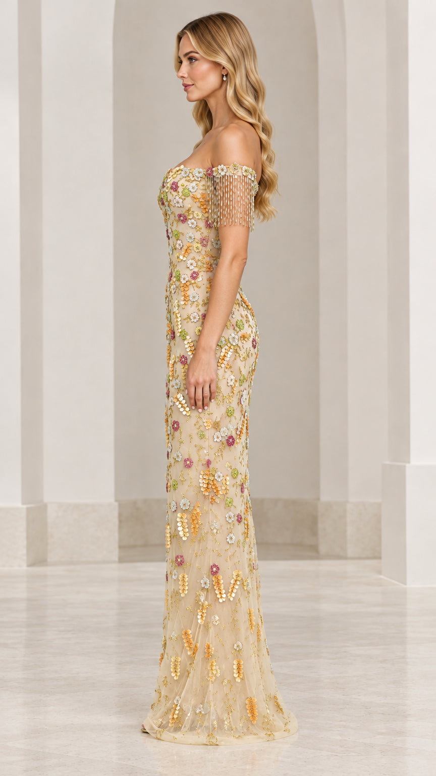 Side profile view of champagne floral sequin evening gown with beaded fringe detail