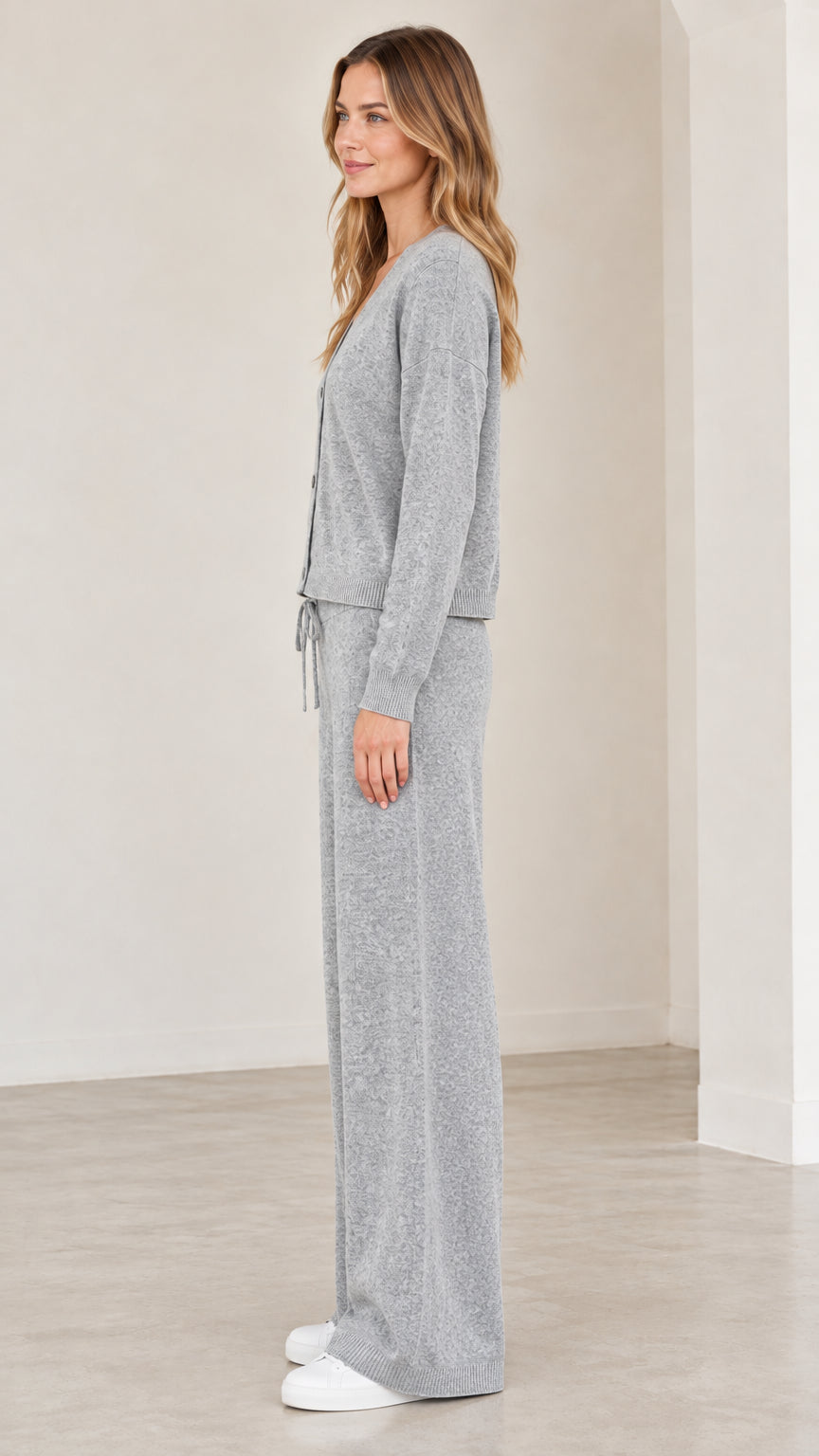 Side profile view of woman wearing grey knit lounge set
