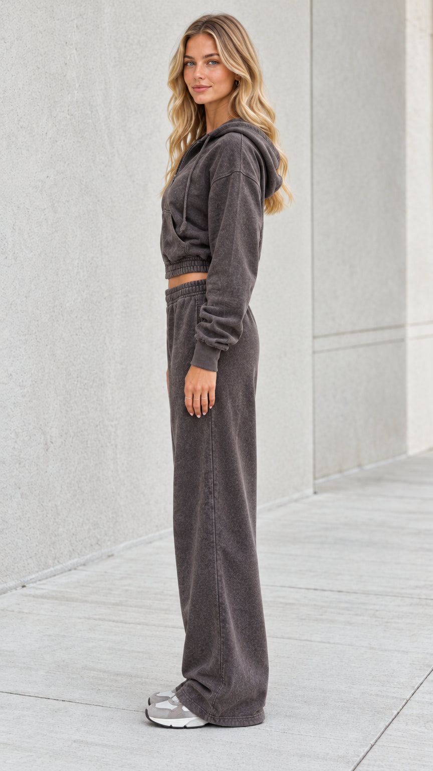 Side profile view of model wearing washed charcoal two piece loungewear tracksuit