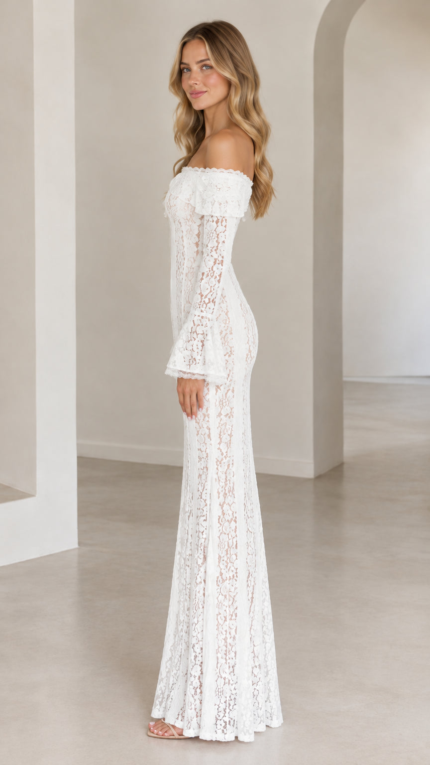 Side profile of white off-the-shoulder floral lace maxi dress showing silhouette