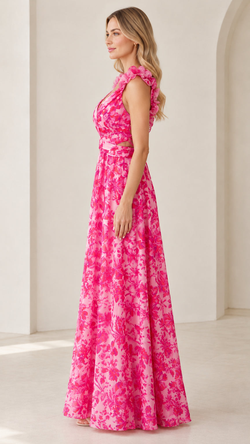 Side profile of model wearing bright fuchsia floral A-line maxi gown