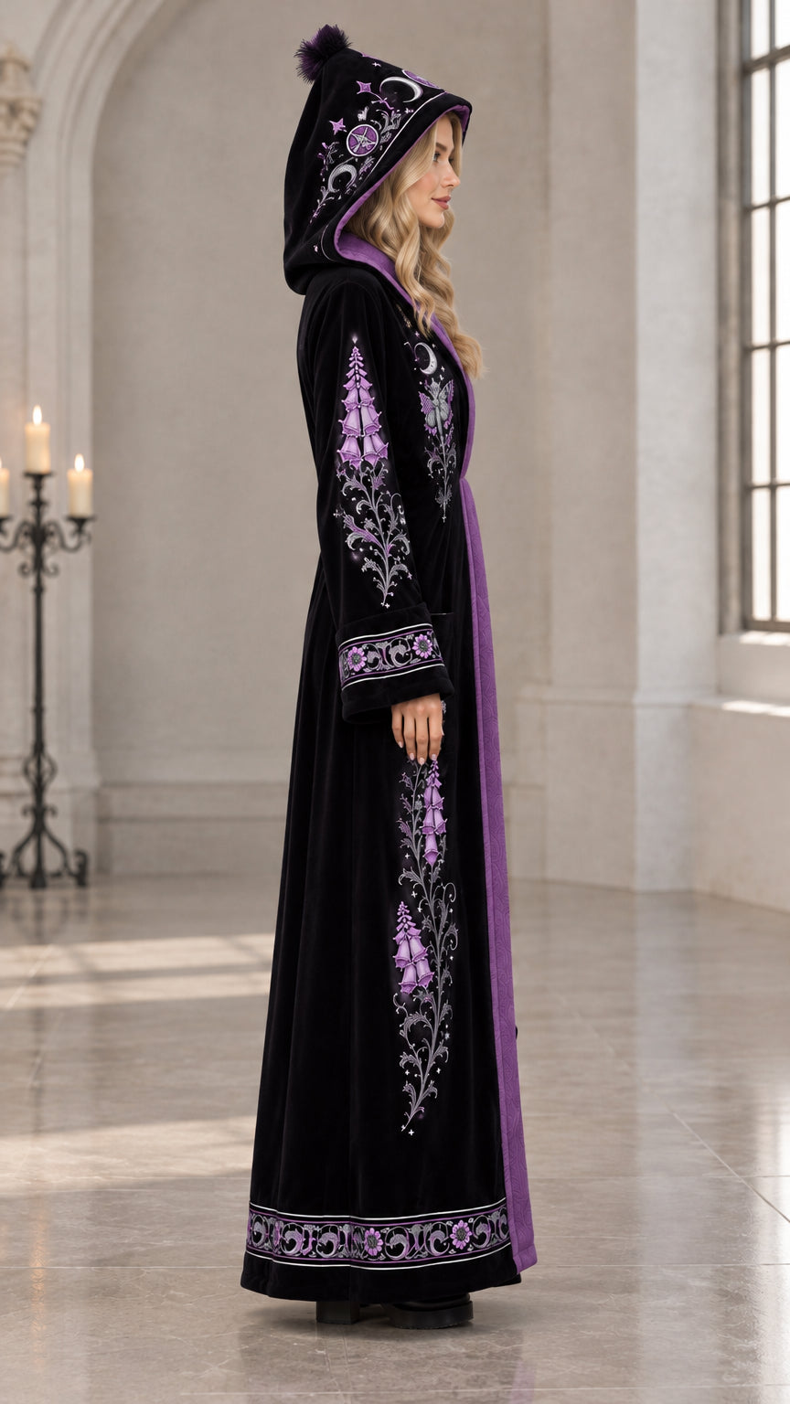 Side profile of black celestial embroidered velvet hooded maxi robe