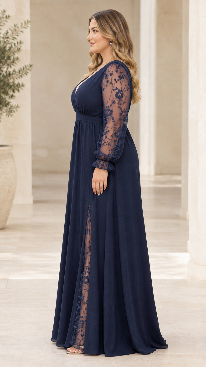 Side profile of navy blue long sleeve formal maxi dress showing silhouette and slit