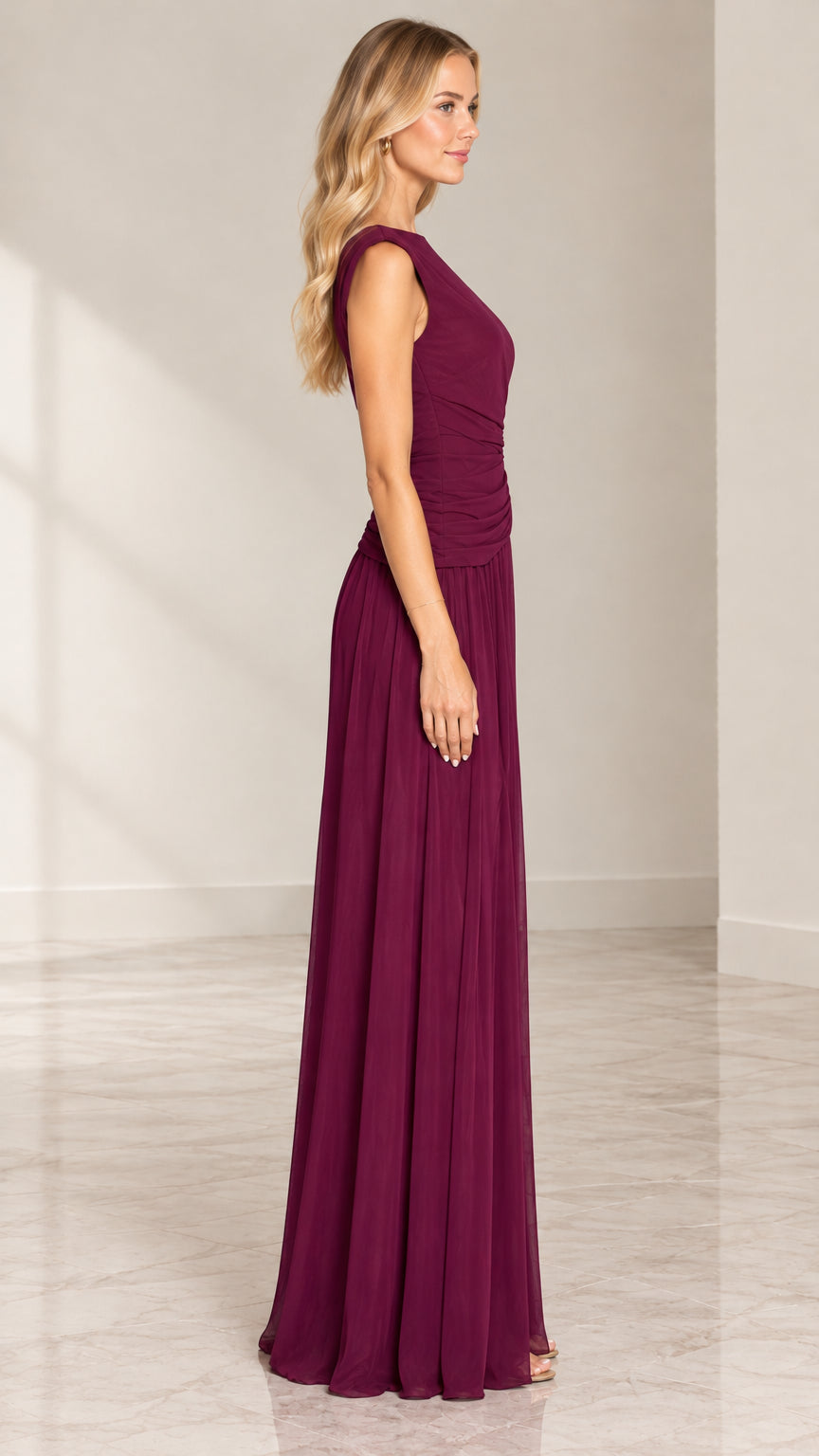 Burgundy maxi evening gown side view showcasing ruched waist and floor length