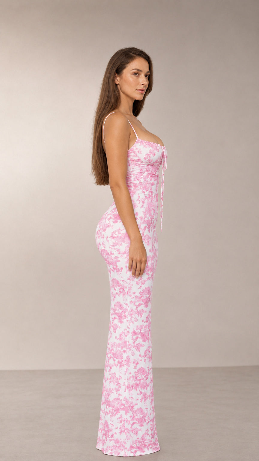 Side profile view of pink toile print column maxi dress