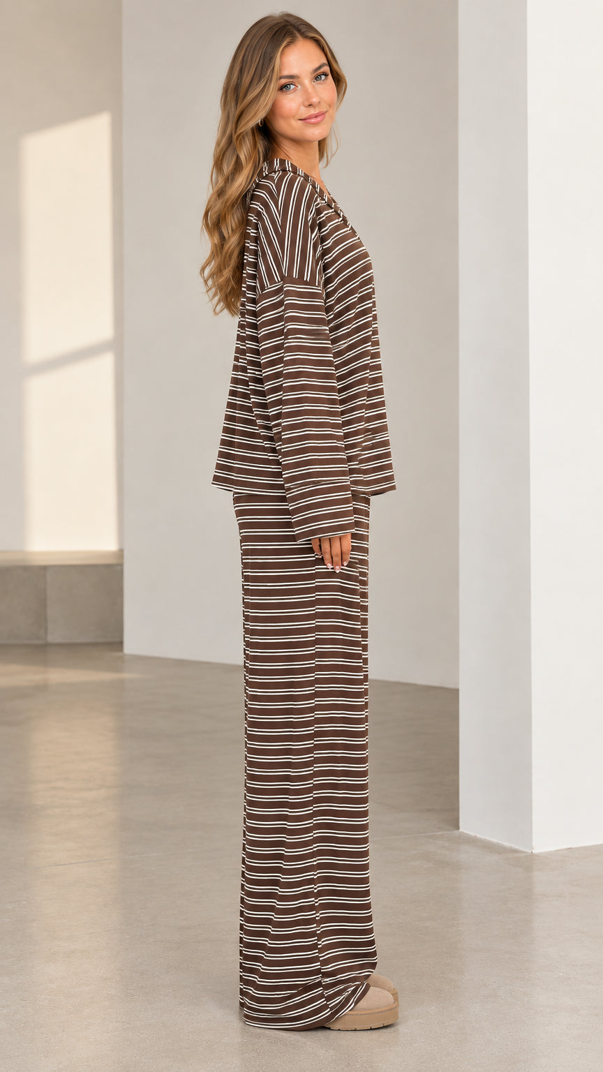 Side profile view of woman wearing brown striped relaxed loungewear set