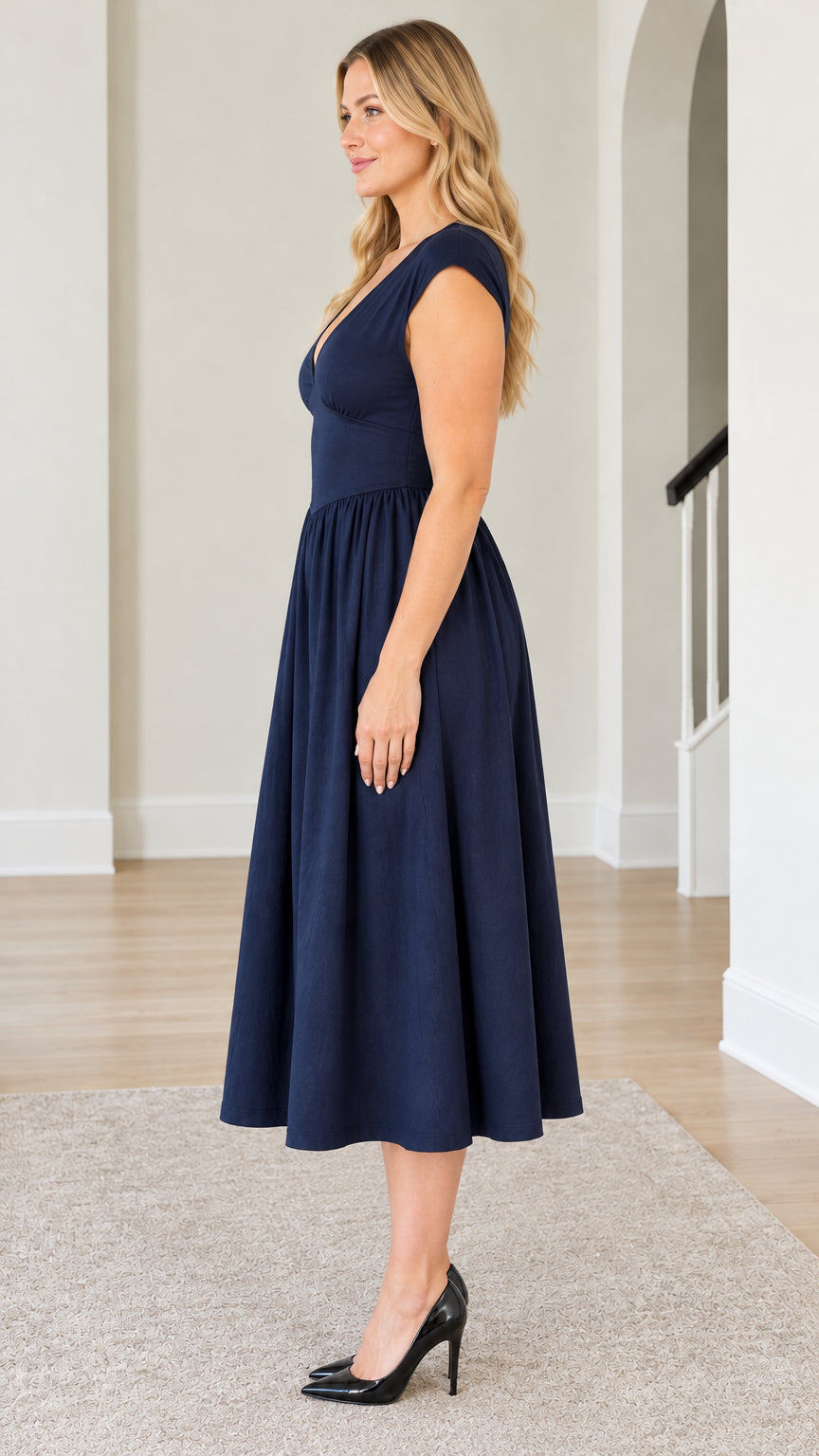 Side profile view of Navy Blue A-line midi dress showcasing silhouette and skirt length