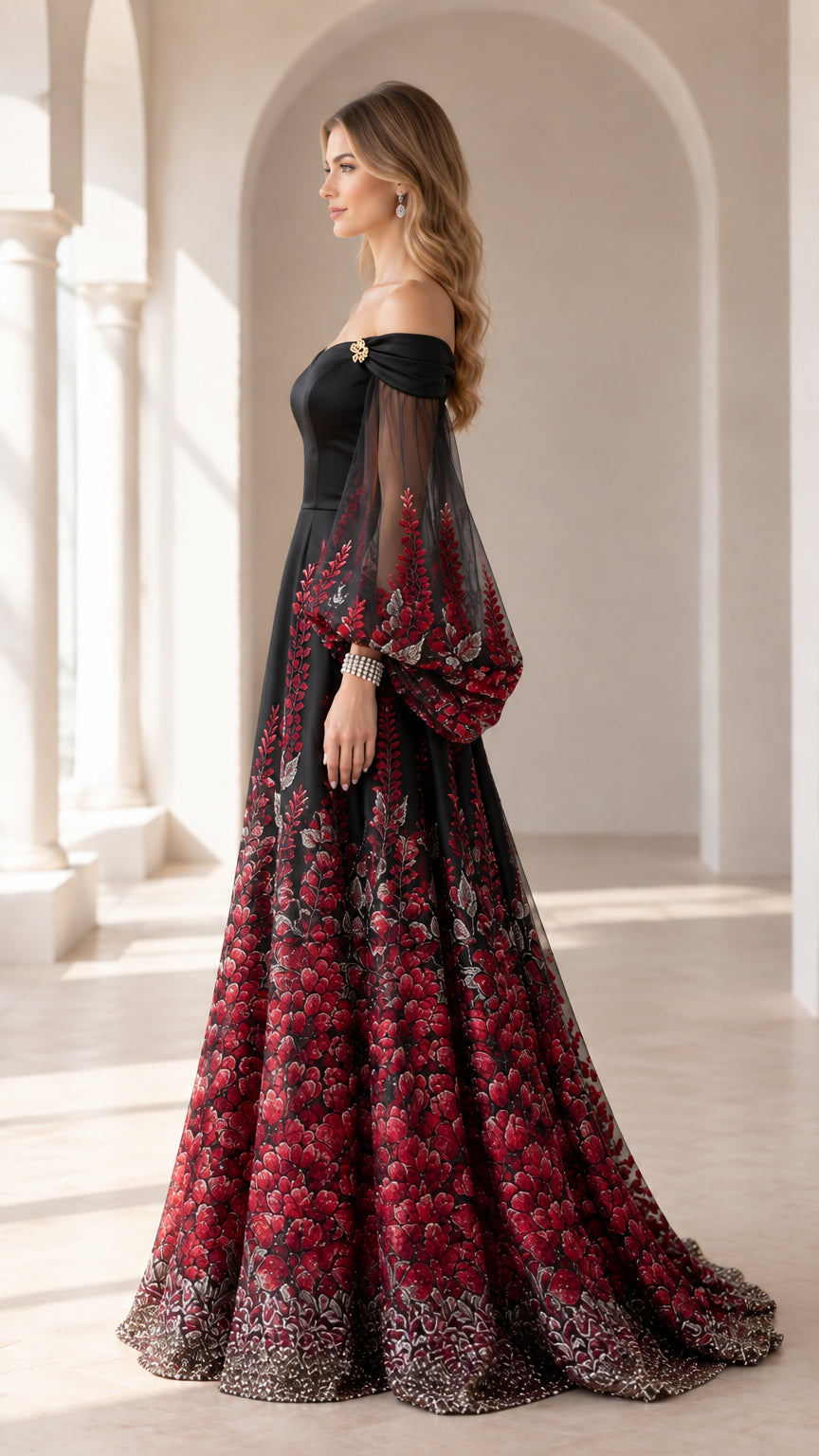 Side profile of black and red embroidered A-line ball gown with sheer sleeves