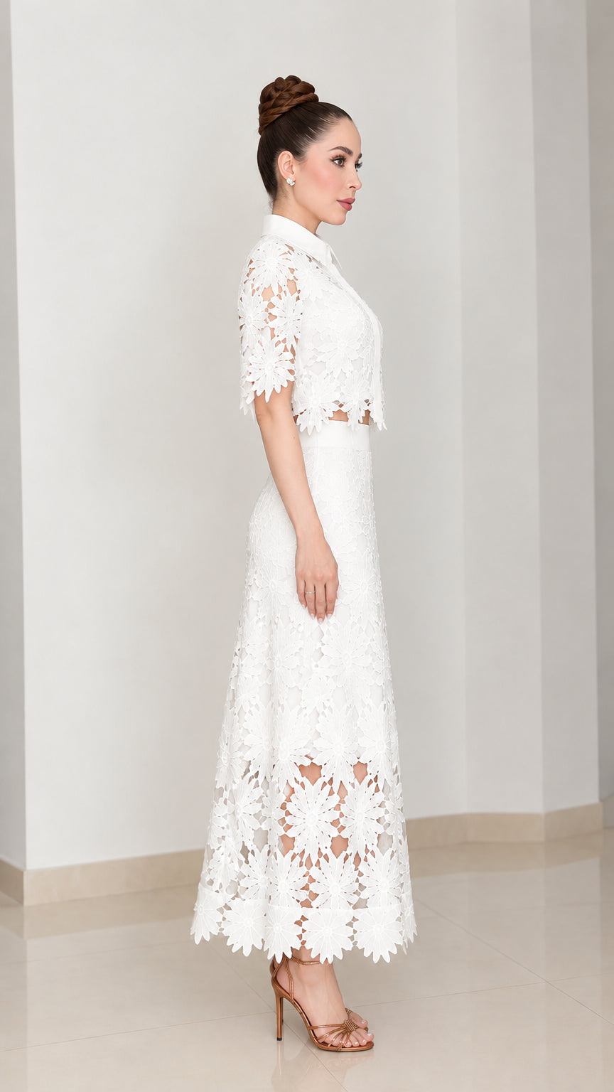 Side profile view of model in white floral cutwork lace two-piece skirt set