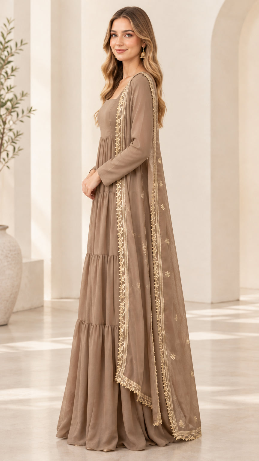 Side profile view of taupe square-neck tiered maxi gown and sheer embroidered scarf