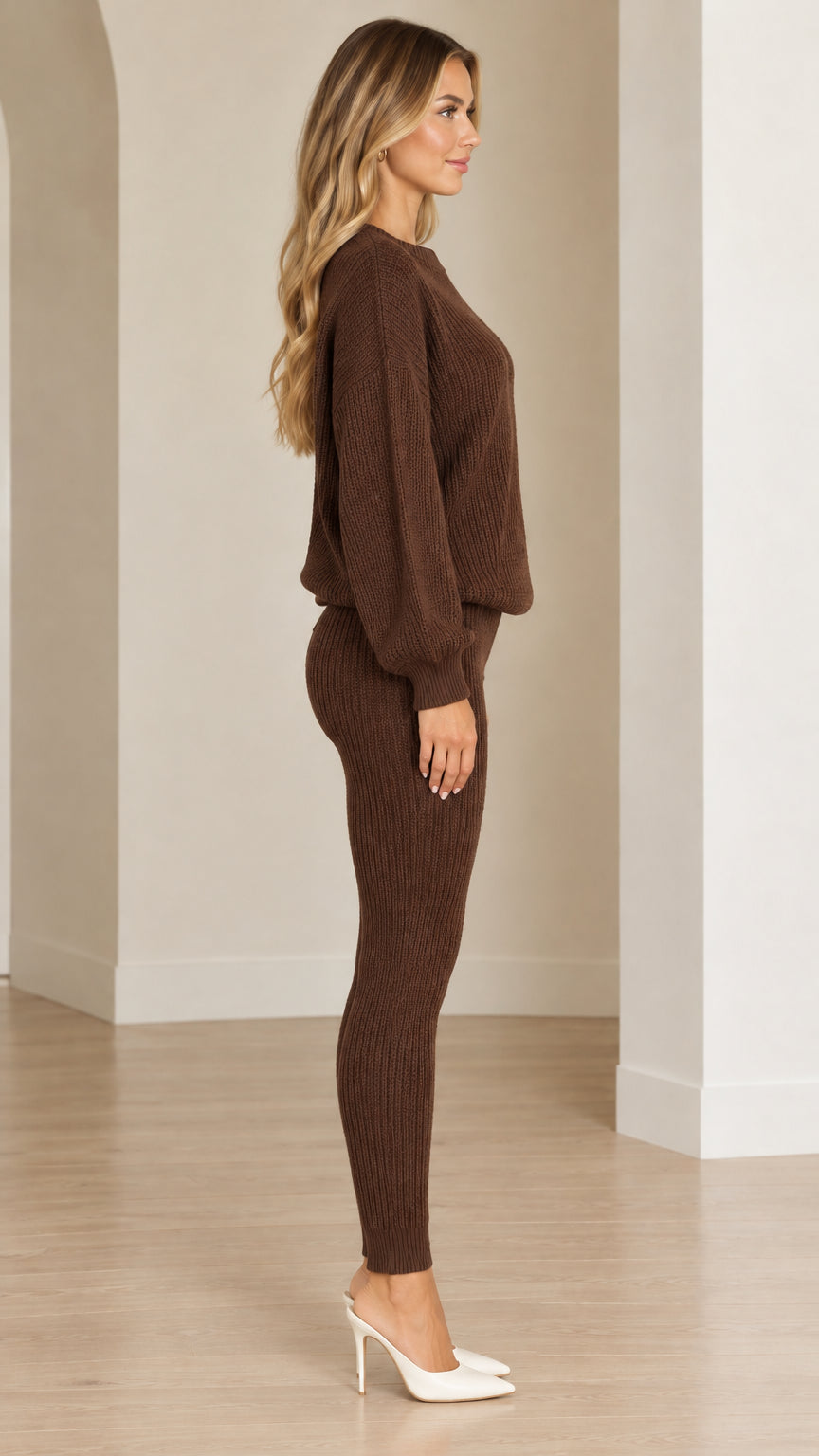 Side profile view of woman wearing brown ribbed knit sweater and leggings set