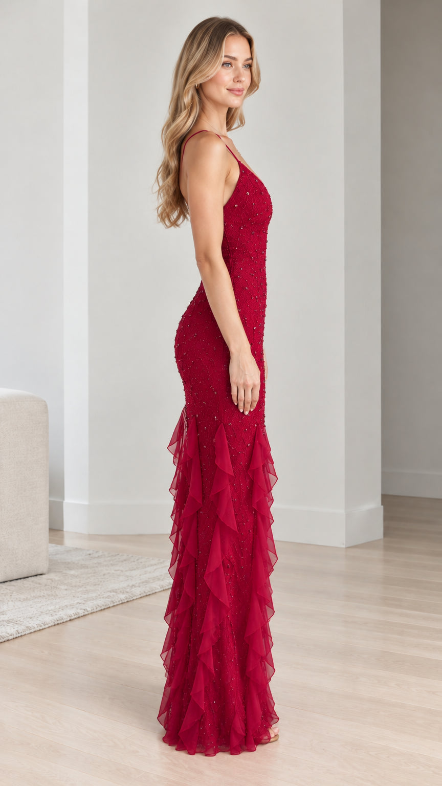Side profile view of model in a ruby red sequin and beaded floor-length formal dress