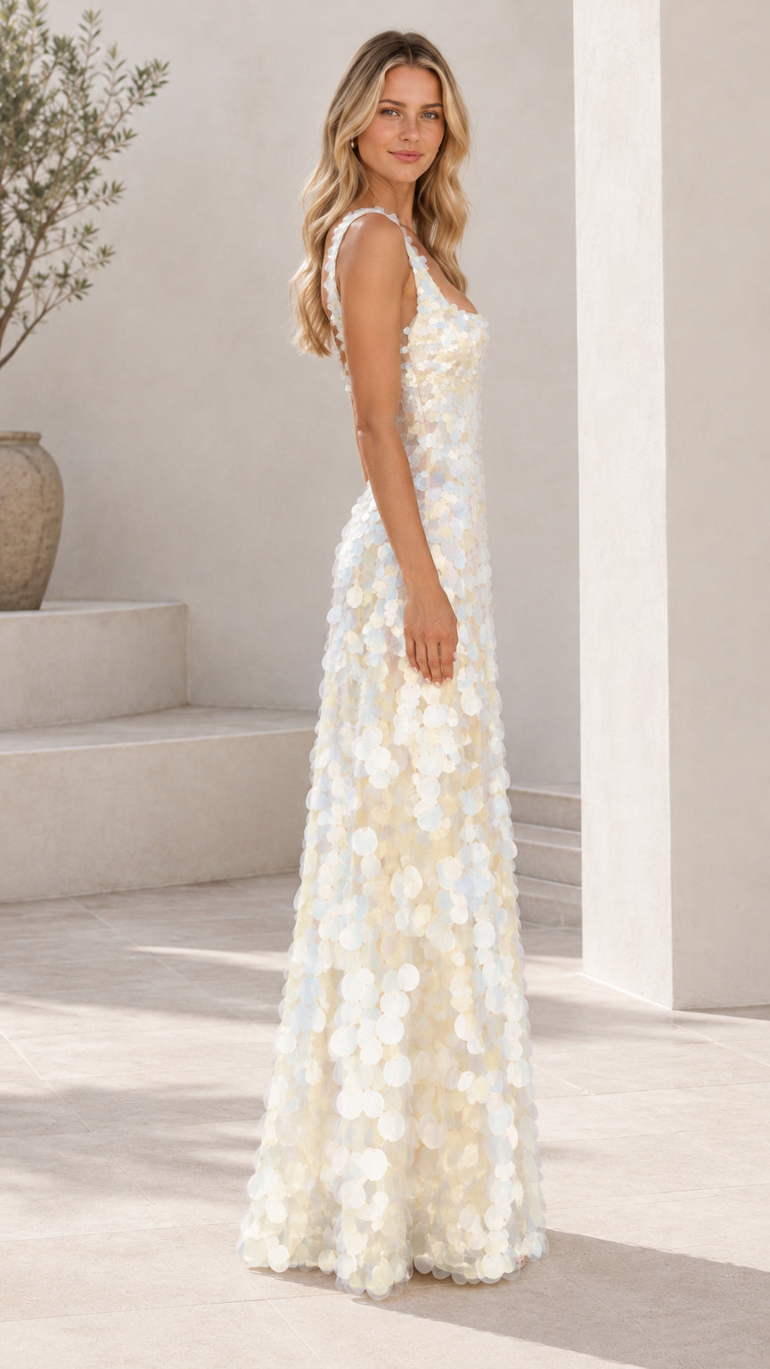 Side profile of ivory white sleeveless shimmering disc sequin evening dress
