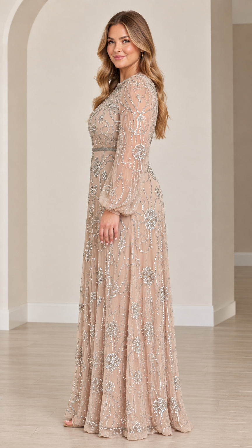 Side profile view of champagne floral sequined long sleeve A-line gown