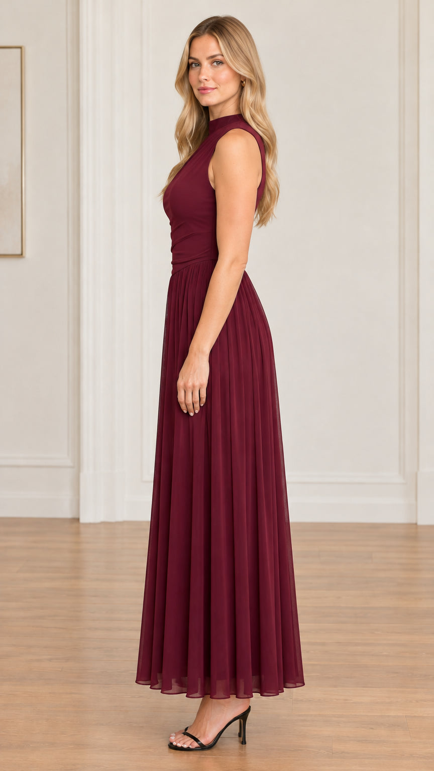 Side profile view of model wearing burgundy draped bodice maxi dress