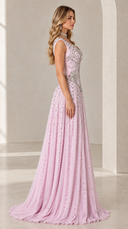 Side profile view of model wearing Blush Pink floor-length embellished evening gown