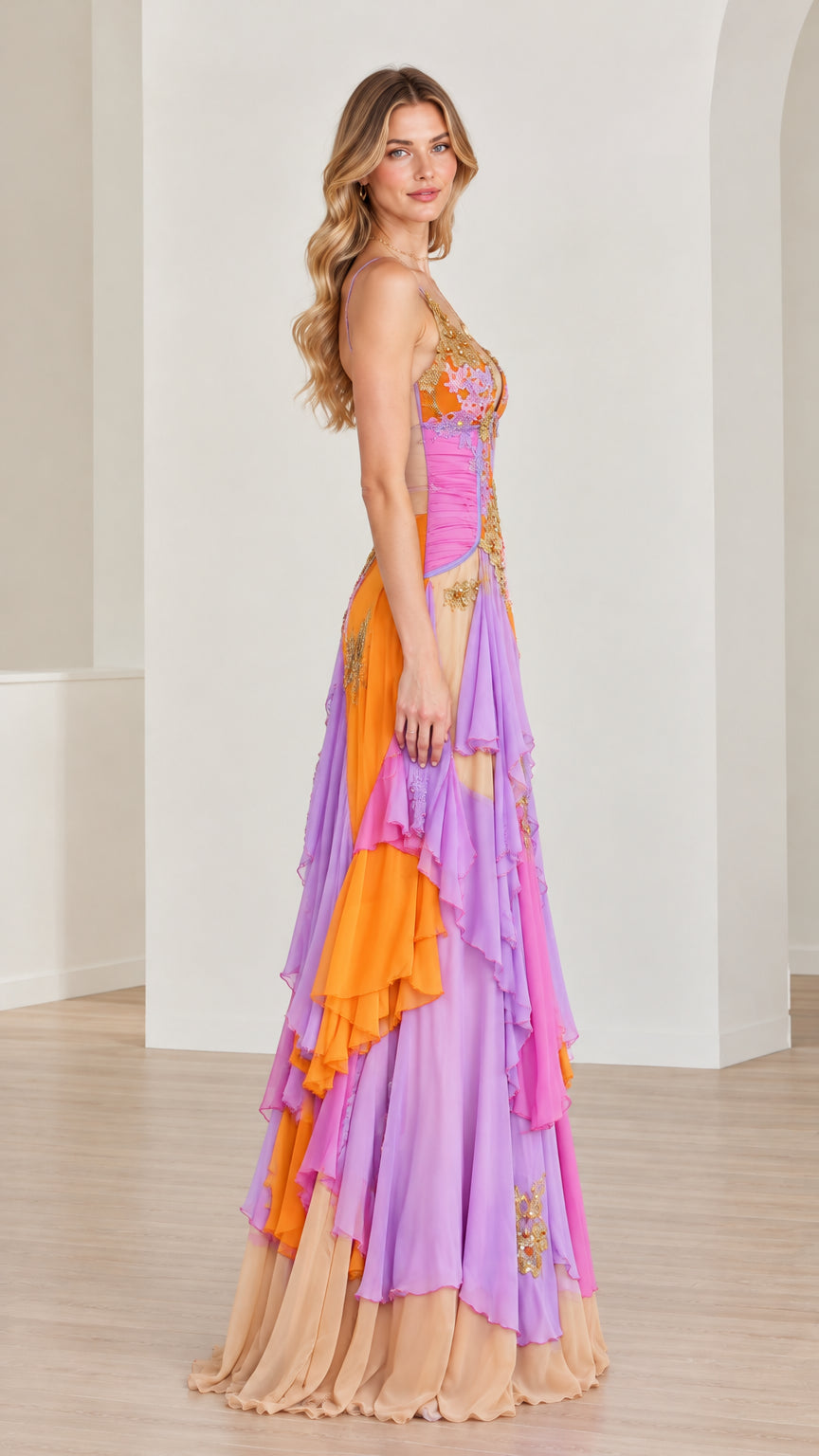 Side profile of model in multicolor cascading tiered ruffle maxi gown