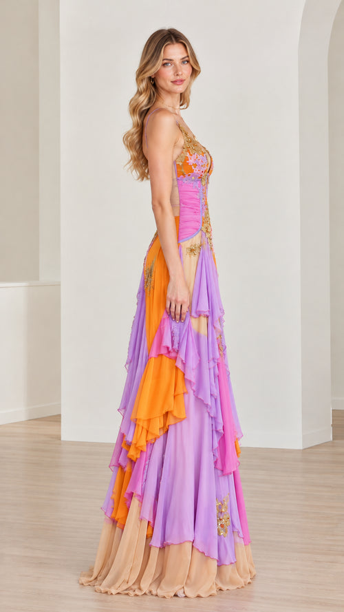 Side profile of model in multicolor cascading tiered ruffle maxi gown
