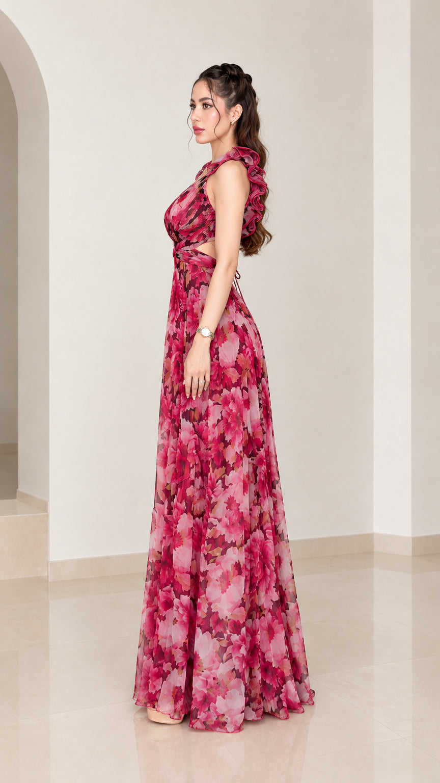 Side profile of woman wearing magenta floral backless maxi dress