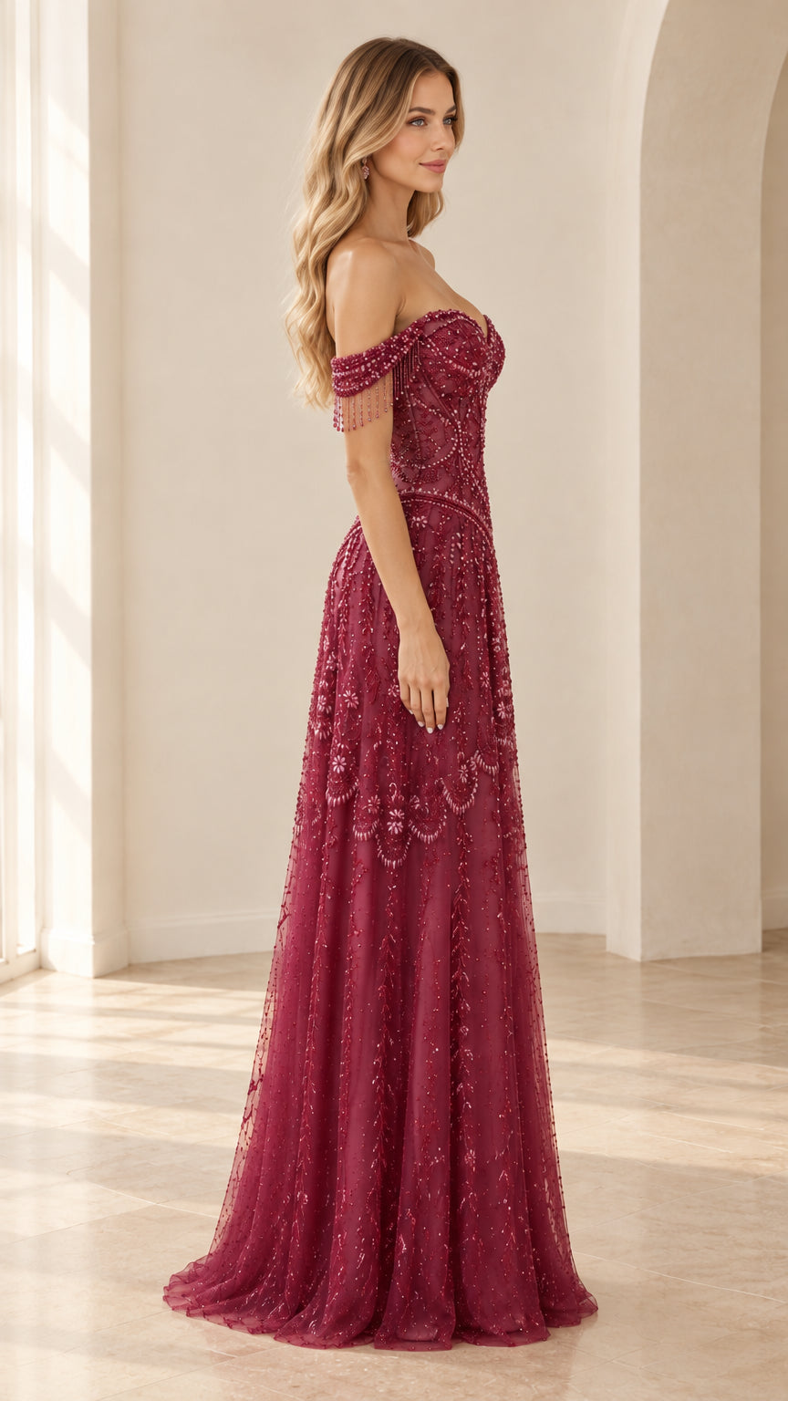 Side profile view of burgundy beaded corset maxi gown showing A-line silhouette