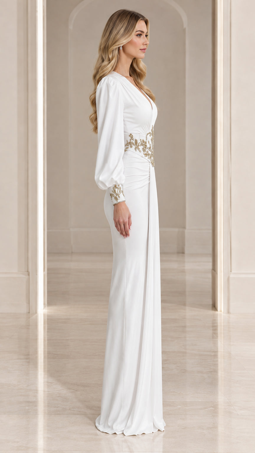 Side profile view of model wearing white long sleeve embroidered evening gown