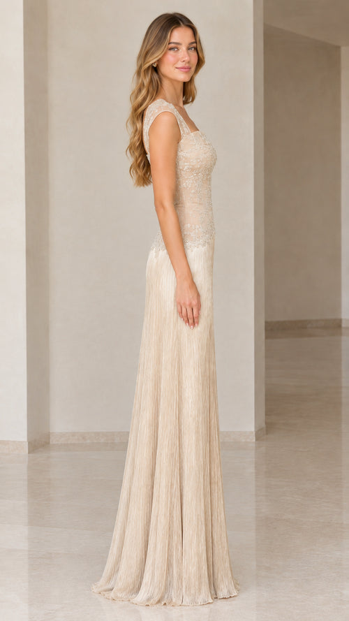 Side profile of champagne embroidered cap sleeve maxi dress with flowing fringe detail