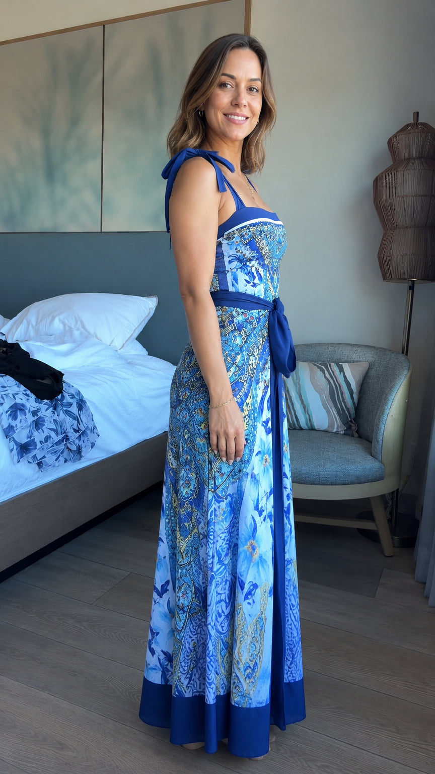 Side profile of model wearing Royal Blue paisley print sleeveless maxi dress