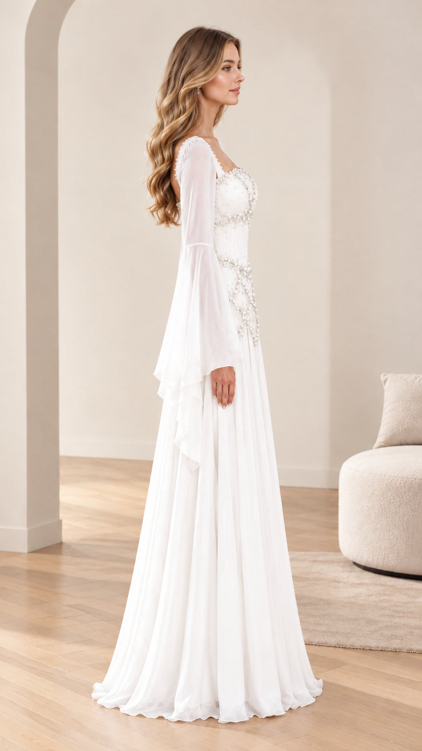 Side profile of model in elegant white bell-sleeve maxi gown with draped pearl details