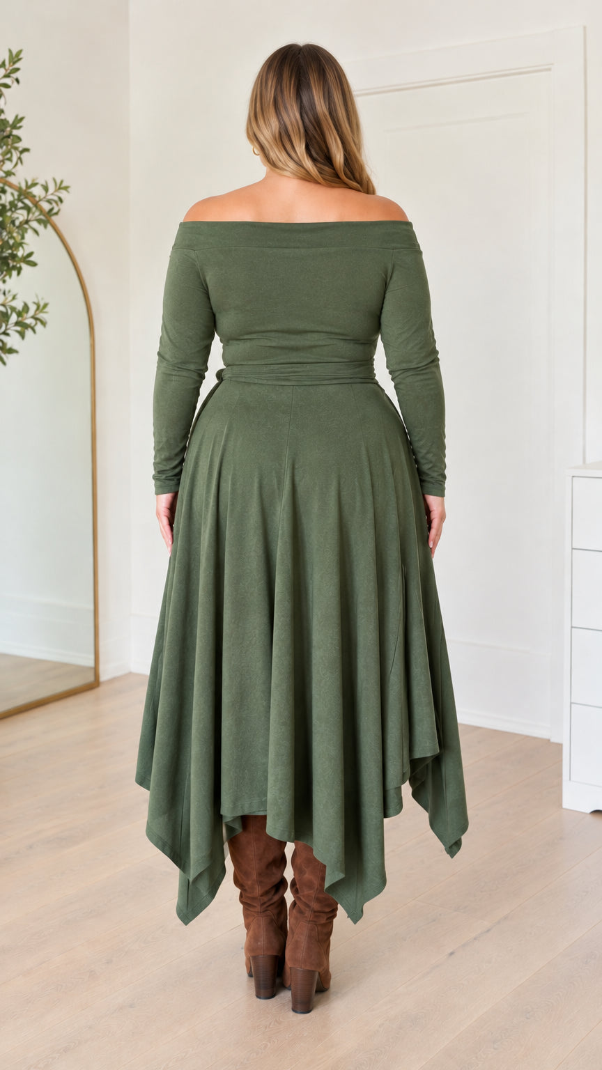 Rear full-length view of woman wearing the olive green handkerchief hem dress
