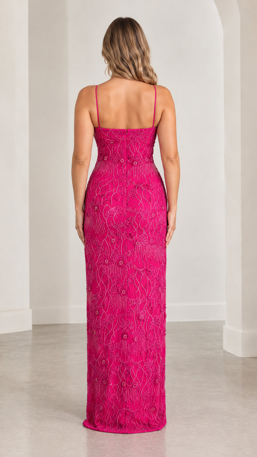 Model wearing fuchsia beaded spaghetti strap gown back view