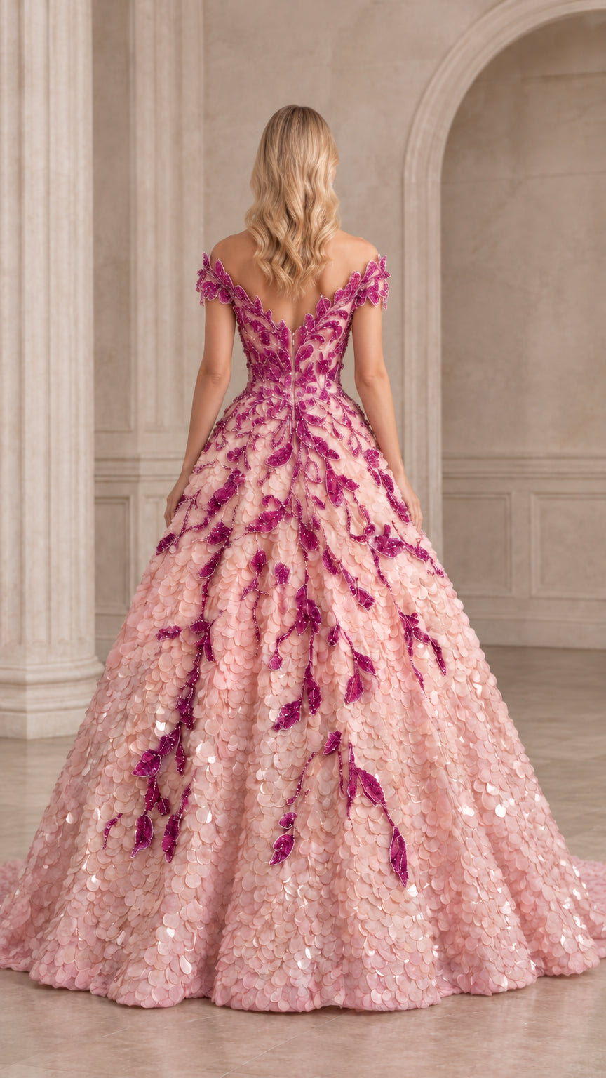 Back view of the light pink embroidered ball gown showing the V-back design