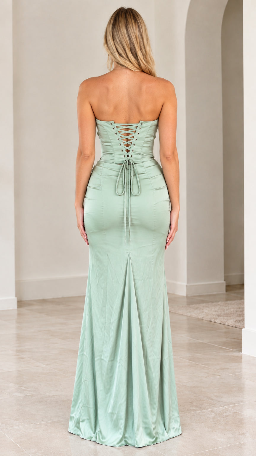 Back view of sage green maxi dress showing adjustable lace-up corset back detail