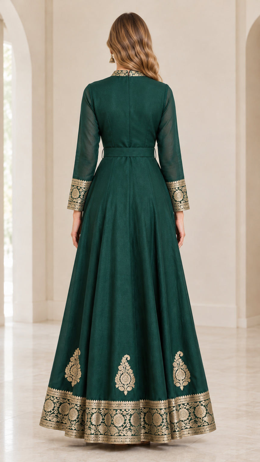 Back view of emerald green maxi dress showing back zip closure and full-length drape