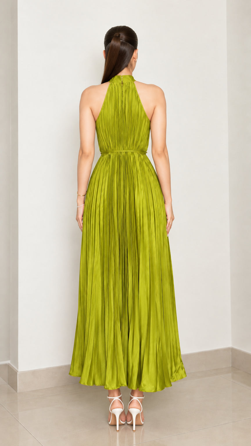 Back view of chartreuse green pleated halter neck maxi dress showing back zip closure