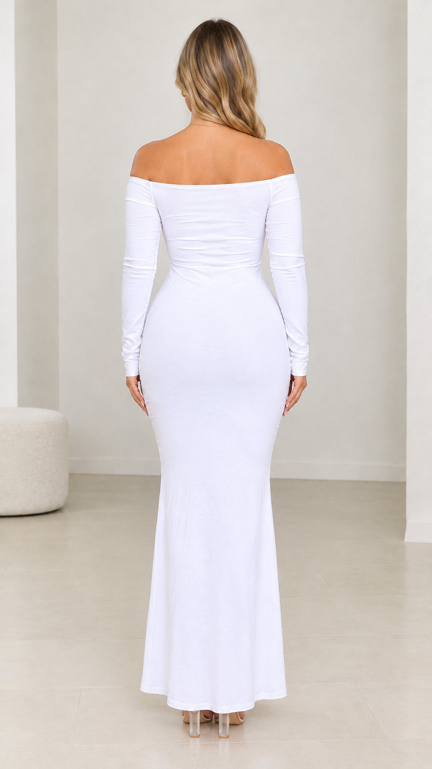 Back view of model wearing white off-the-shoulder long sleeve maxi dress