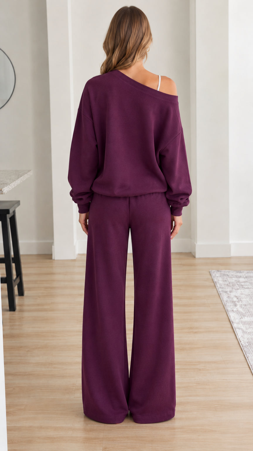 Back view of model wearing relaxed plum off-shoulder lounge set