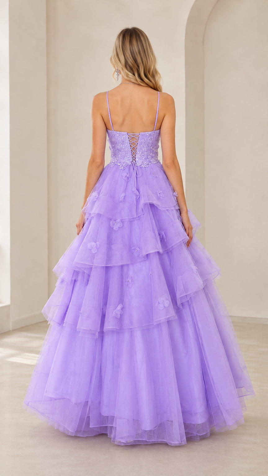 Back view of lavender ball gown highlighting corset lace-up closure and tiered skirt