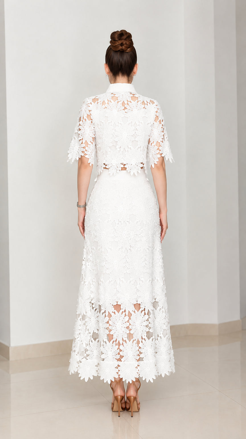 Back view of model wearing white lace shirt and high-waisted maxi skirt set