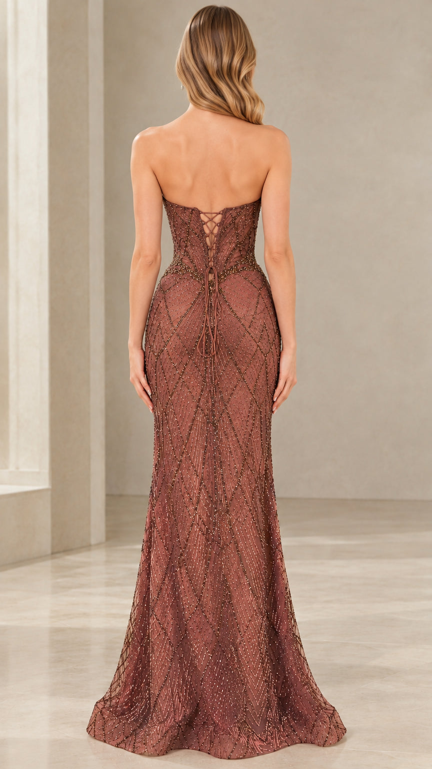 Back view of model showing lace-up corset back on dusty rose beaded evening dress