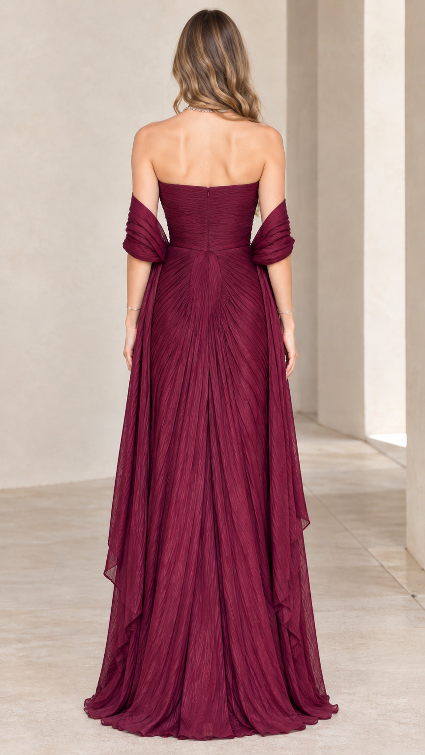 Back view of model in burgundy strapless floor-length pleated evening gown