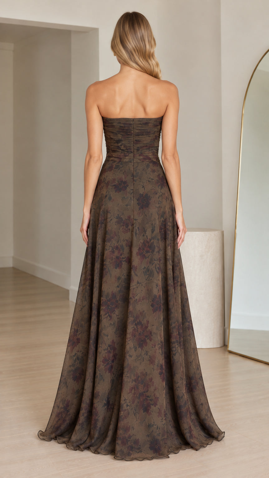 Back view of woman wearing olive green strapless floral maxi gown