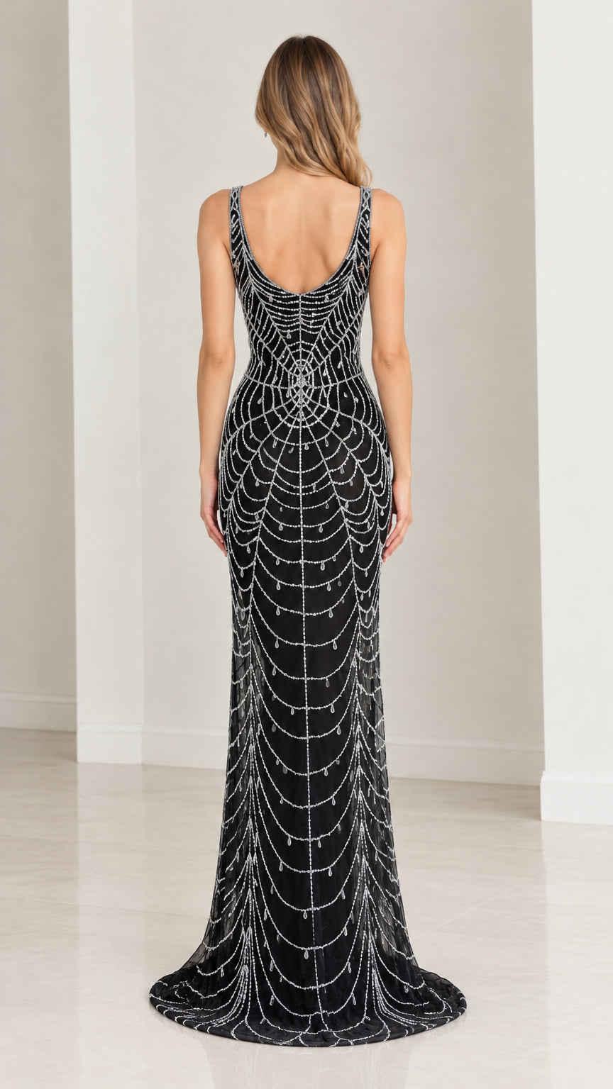 Back full-length view of woman showing low scoop back of black beaded formal gown
