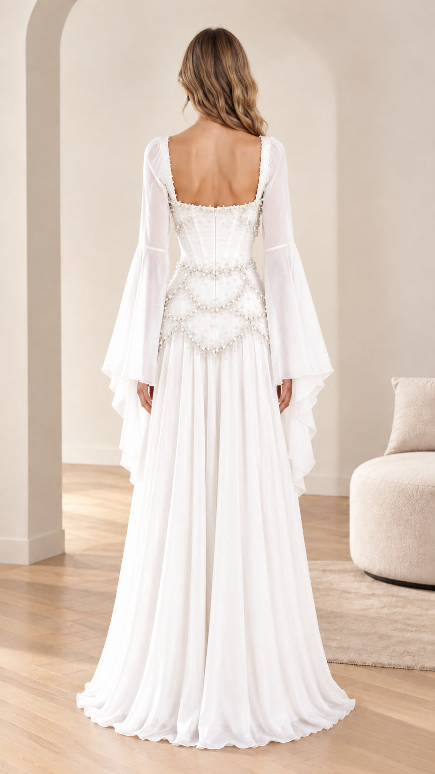 Back view of white flowing maxi dress with square back neckline and dramatic bell sleeves