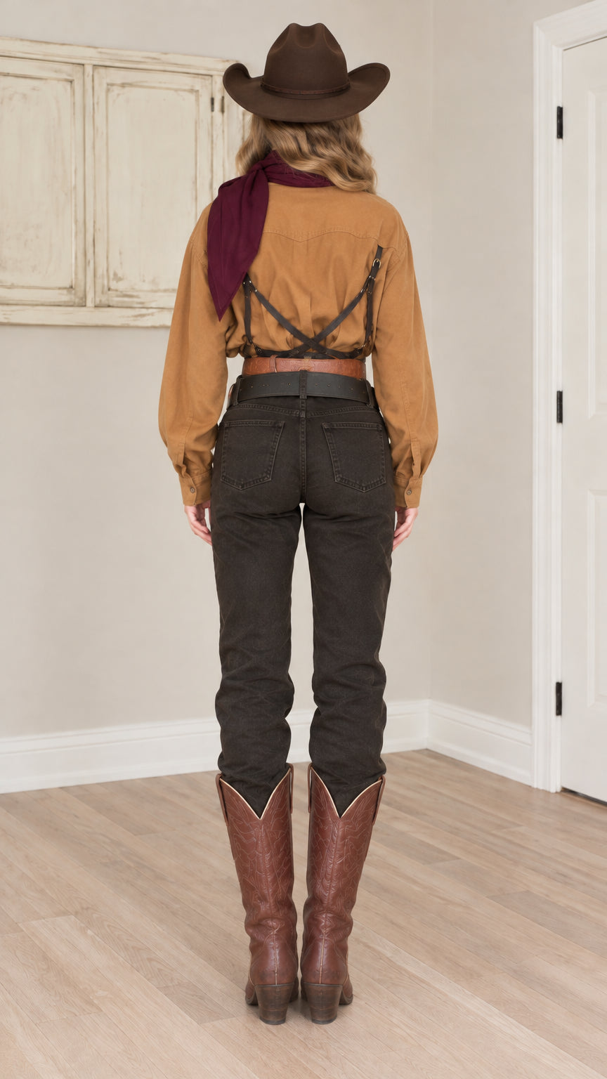 Back full view of woman wearing caramel western long sleeve shirt tucked into jeans
