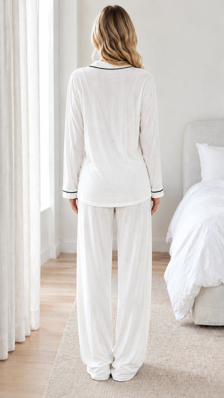 Back full view of woman wearing white long sleeve pajama set