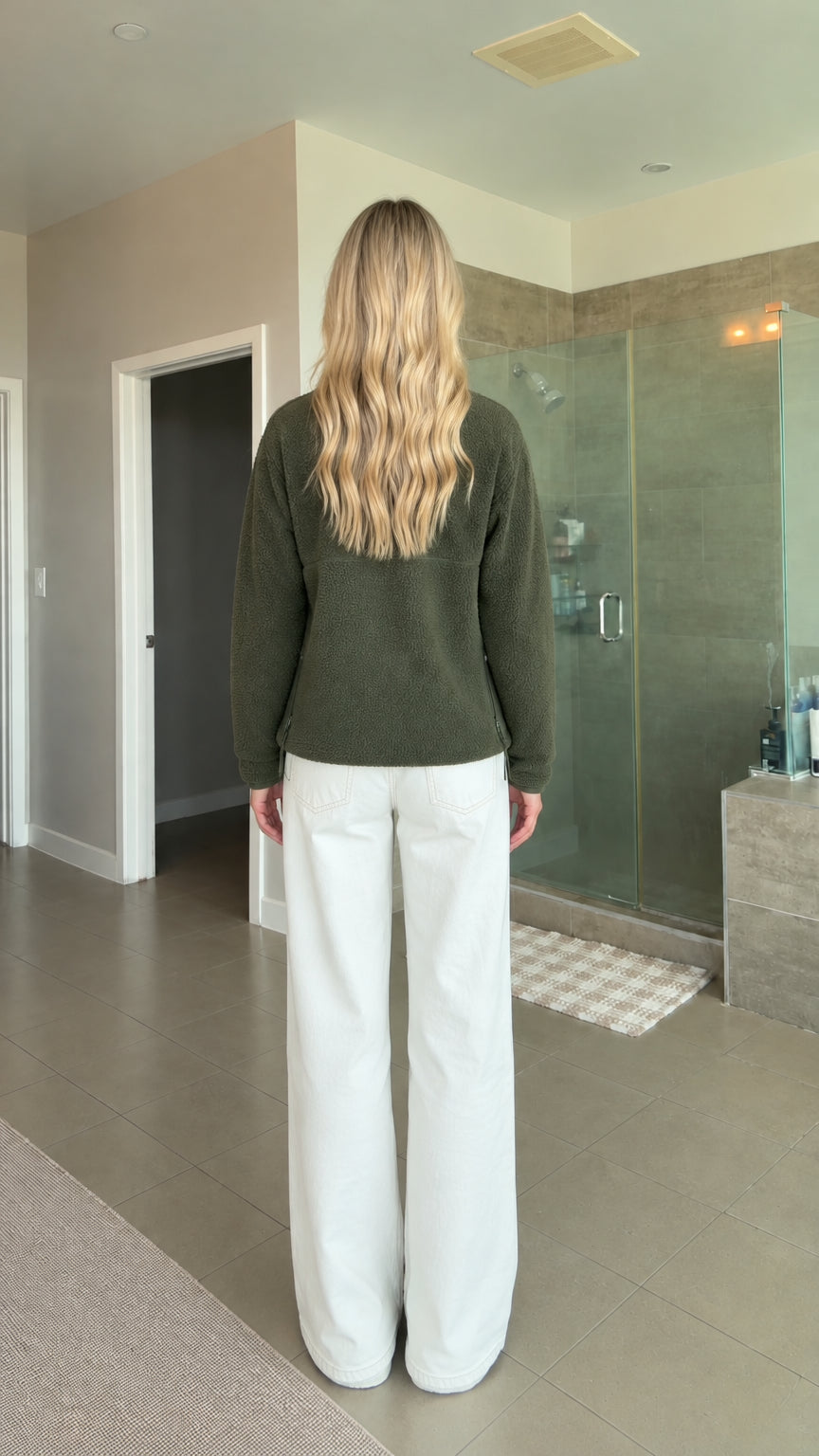 Model wearing army green half-zip fleece pullover back view