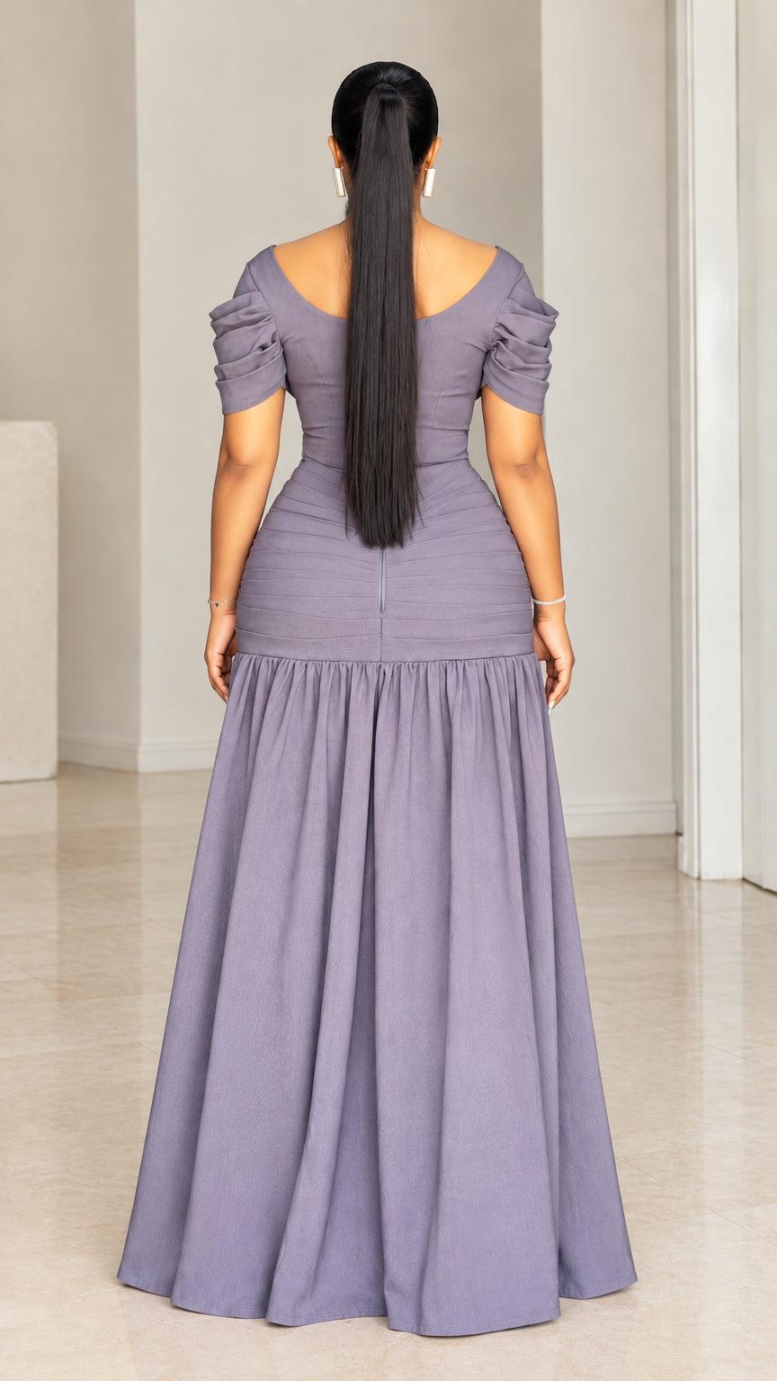Back view of woman wearing dusty purple floor-length dress showing back zipper closure
