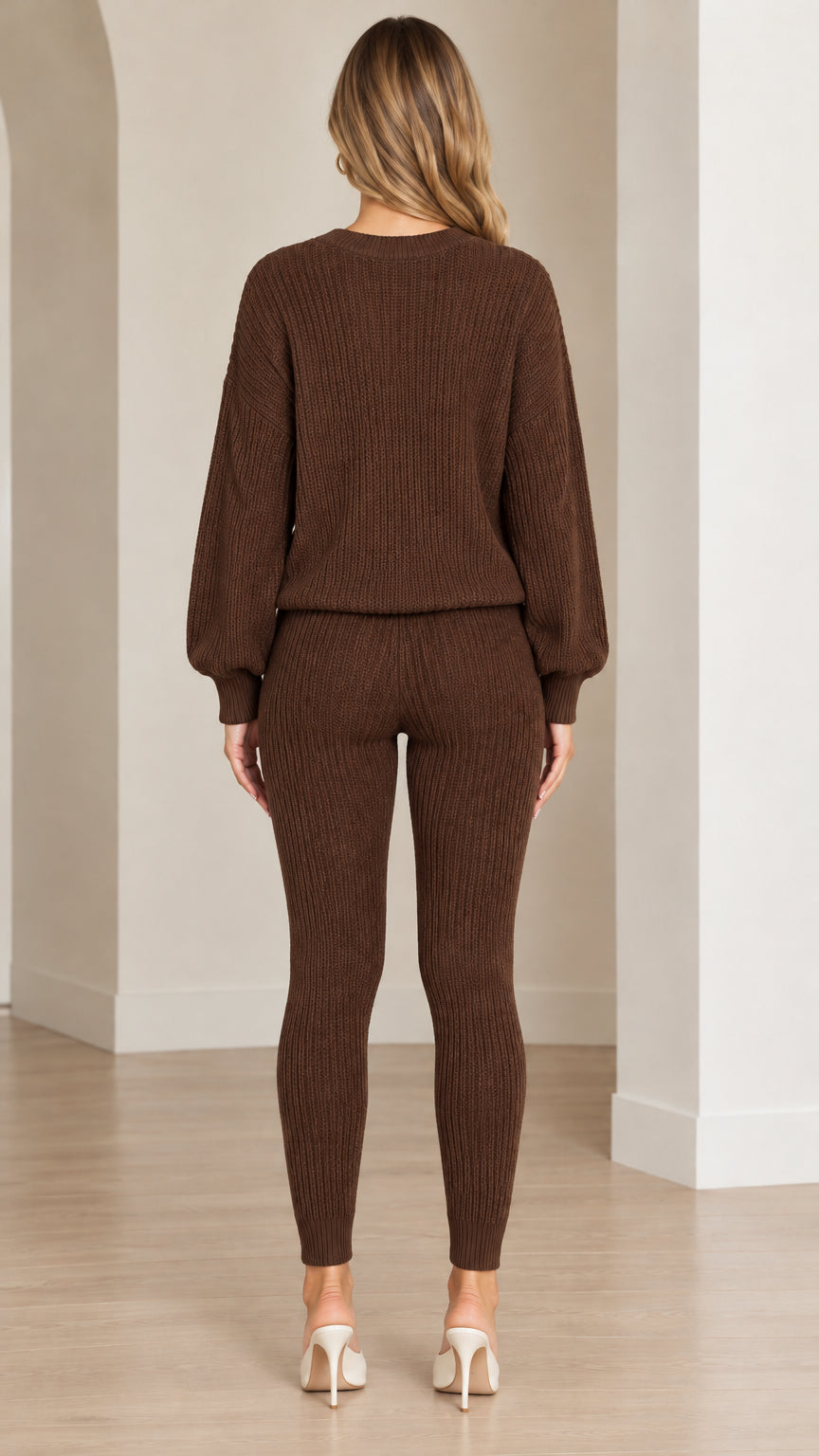Back full-length view of woman wearing brown ribbed knit sweater and leggings set