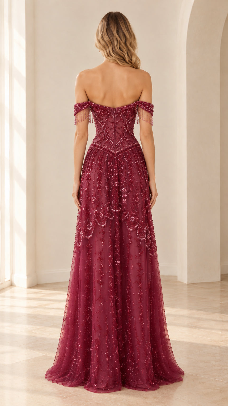 Rear view of burgundy beaded evening gown with boned corset back and floor-length skirt