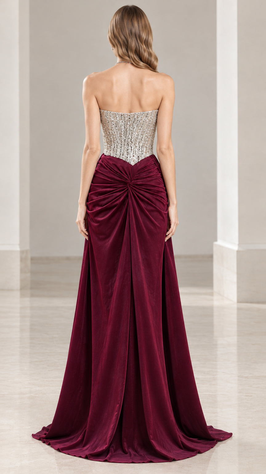 Back view of strapless burgundy evening dress showing gathered waist and train